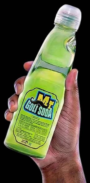 A hand holding a bottle of Green Apple Mr. Goli Soda