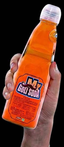 A hand holding a bottle of Orange Mr. Goli Soda
